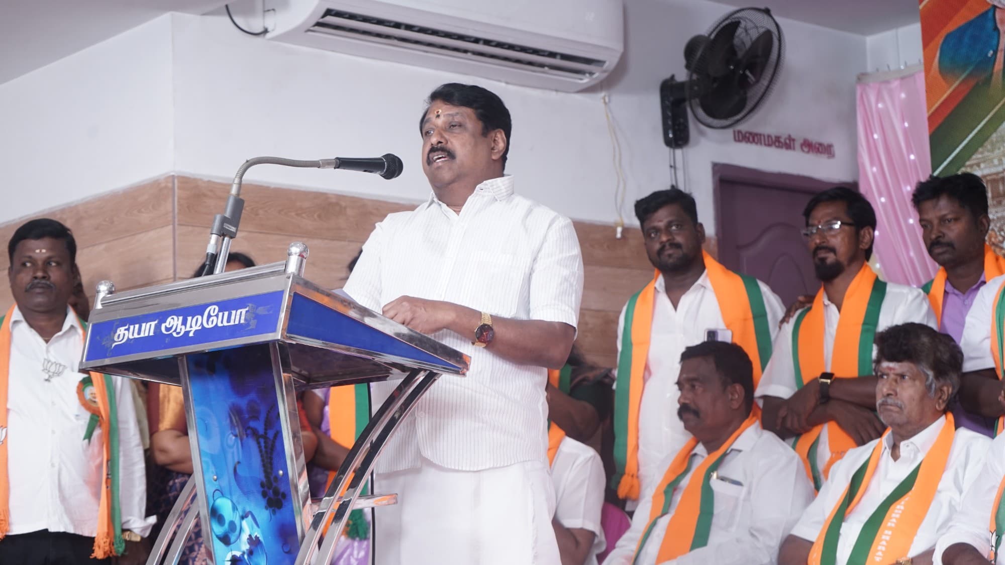 Senthilkumar addresses BJP members from the podium